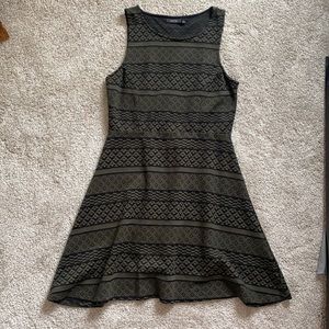 Skater style knee length green and black dress.